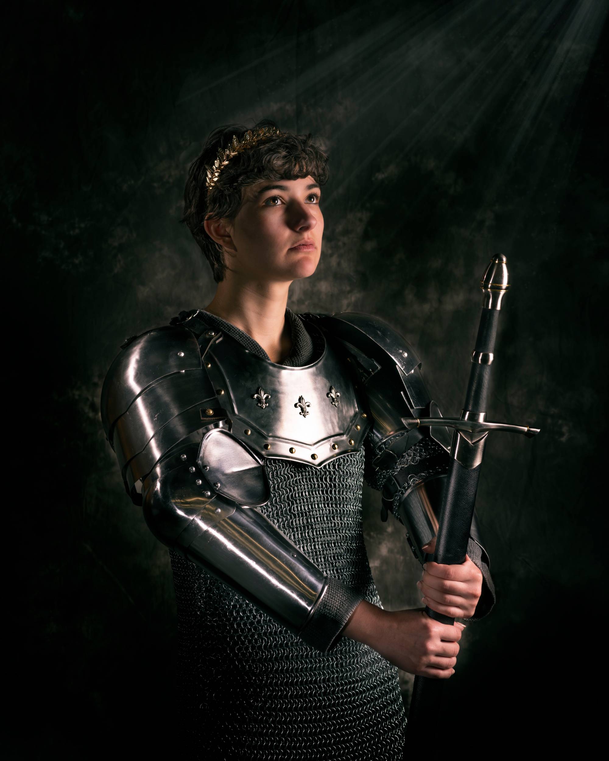 woman wearing medieval armor and holding sword